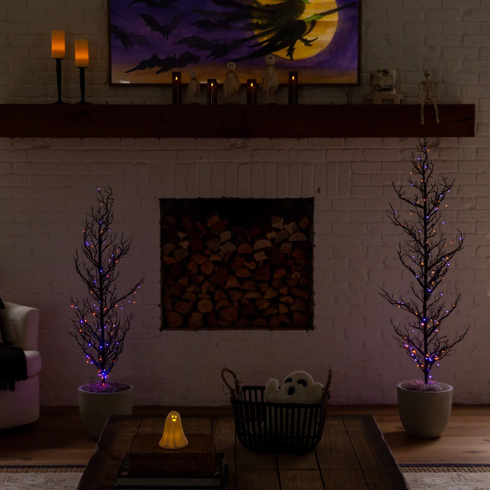 4ft. Pre-Lit Artificial Halloween Black Spooky Twig Tree with 160 Orange & Purple Copper Wire String LED Lights